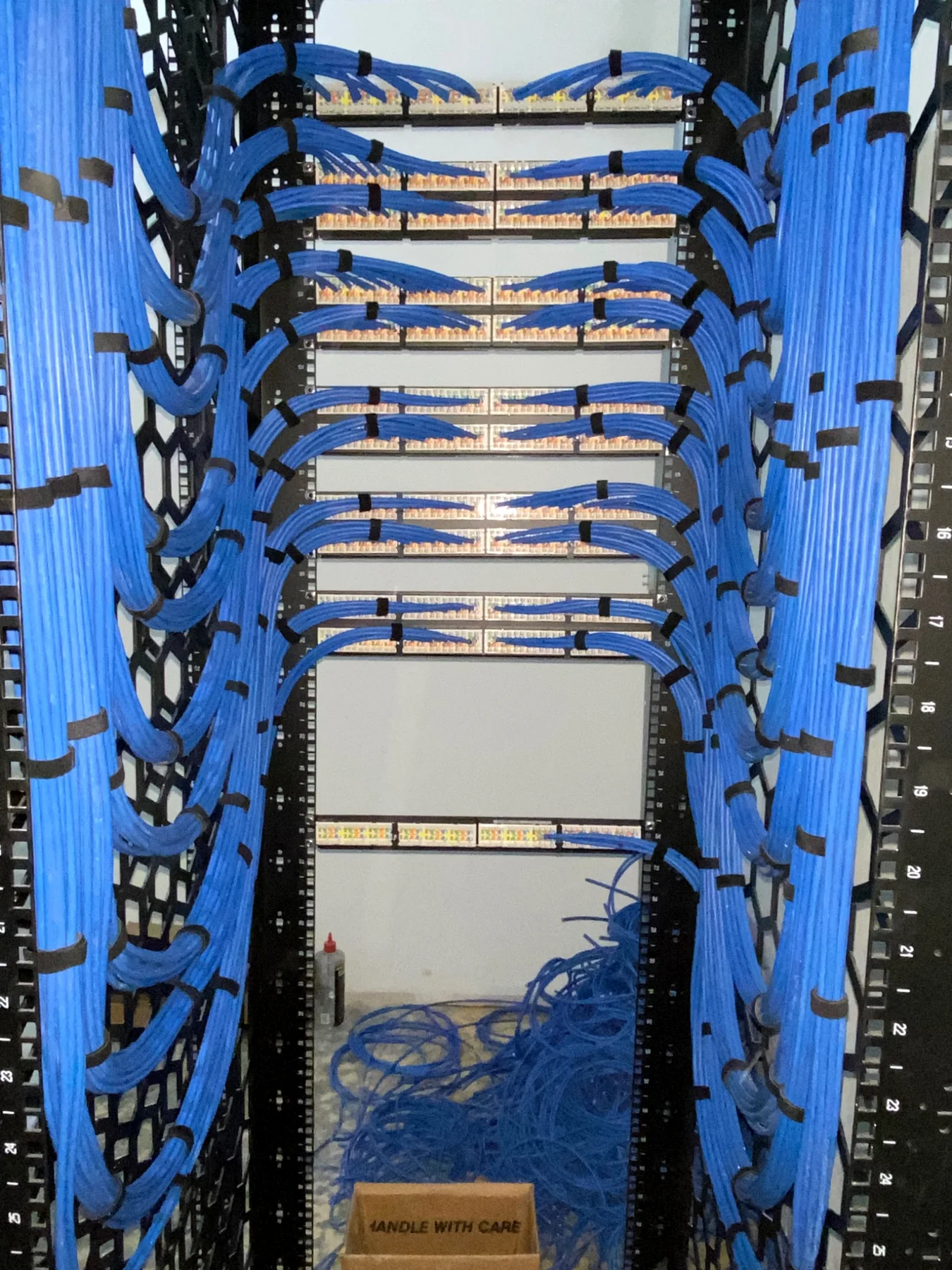 Matching blue structured cabling rack from the same CableLAN MDF / IDF project