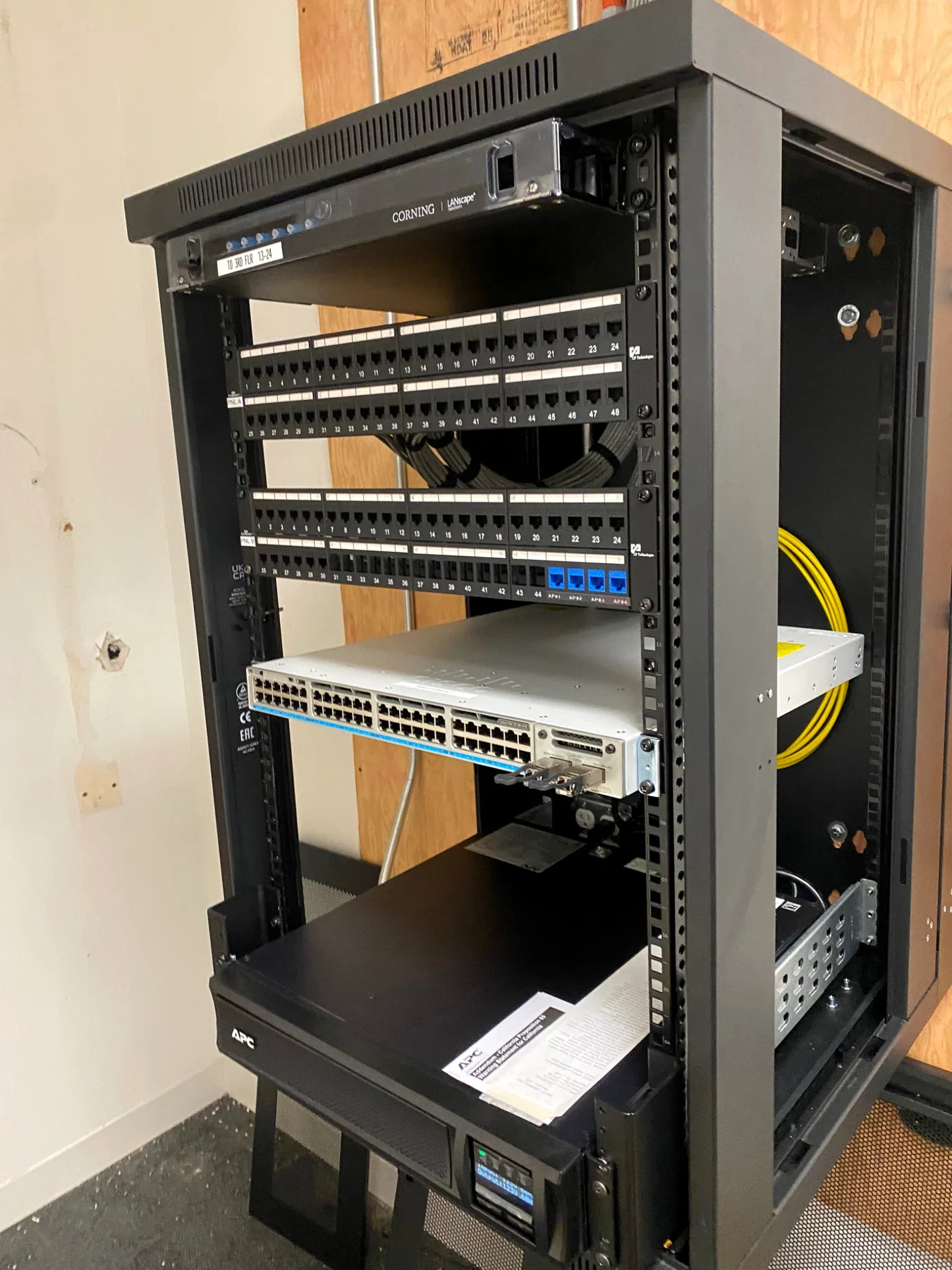 CableLAN finished network rack with patch panels, switch, fiber and UPS